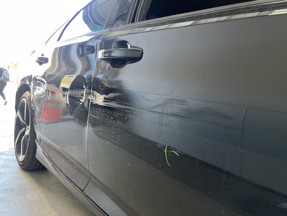 Honda Accord door dent before paintless dent repair at iDeal Automotive Services of Sunset Park Brooklyn